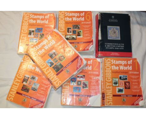 A box containing British Commonwealth 2021 stamp catalogue, Stamps of the World catalogue and others etc 