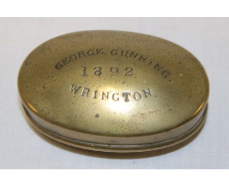 A 19th century Somerset miner's brass oval snuff box, the hinged lid marked "George Gunning 1892 Rington" 