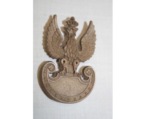 A Second War Polish Army plastic economy beret badge by Stanley of Walsall 