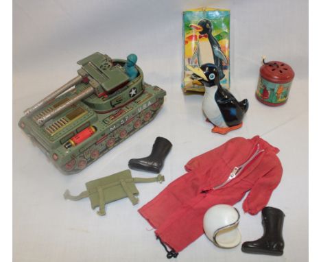A Japanese tinplate battery operated tank, boxed mechanical action walking penguin, Action Man clothing etc 