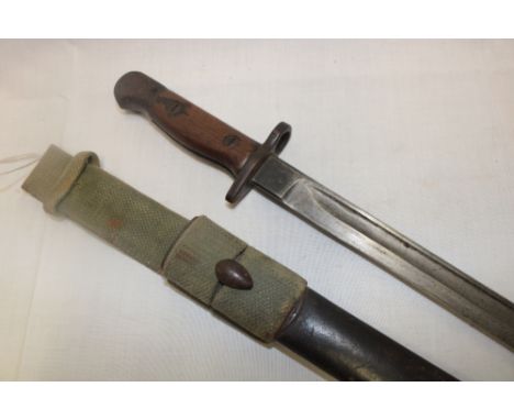 A First War 1907 pattern Lee Enfield bayonet in leather scabbard with webbing frog