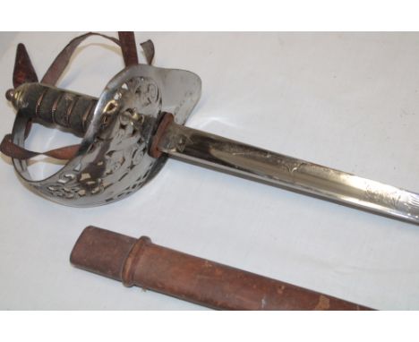 A George V Infantry Officer's sword by Batson of London with etched steel blade, steel guard and wire bound fish skin grip in