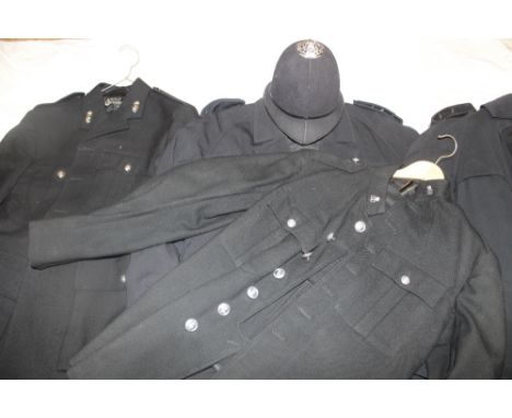 A Cornwall Constabulary double breasted tunic with Special Constabulary collar badges together with a blue cloth helmet minus