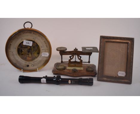 A Mann of Gloucester table top aneroid barometer and thermometer, 20 cm diameter, a set of postage scales, a silver photograp