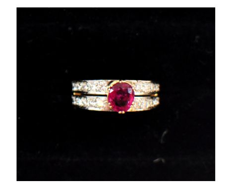 A ring, the central ruby set within two bands of diamonds, in a yellow coloured metal mount  See illustration