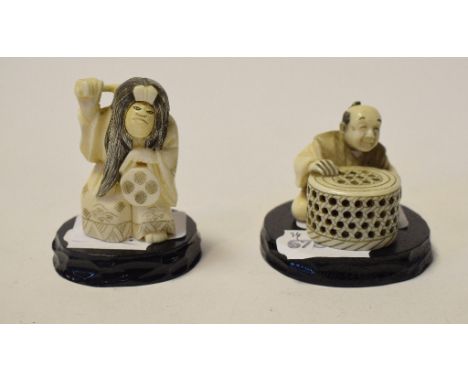 An early 20th century carved ivory netsuke, with a revolving face, signed, 5 cm high, and another similar, the basket make (2