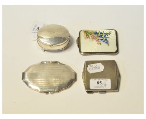 A silver and enamel compact, the cover decorated flowers, Birmingham 1936, two other silver compacts, and a silver trinket bo