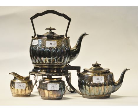 A Victorian silver three piece tea service, monogrammed and with engraved decoration, Sheffield 1980, approx. 21.4 ozt (all i