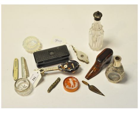 A treen snuff box, in the form of a shoe, with pin work decoration, a bookmark, in the form of a trowel, a silver and mother 