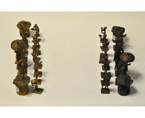An African copper chess set, the pieces in the form of tribal figures and huts