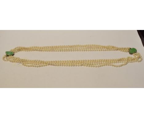 A double four strand necklace, with jade clasp