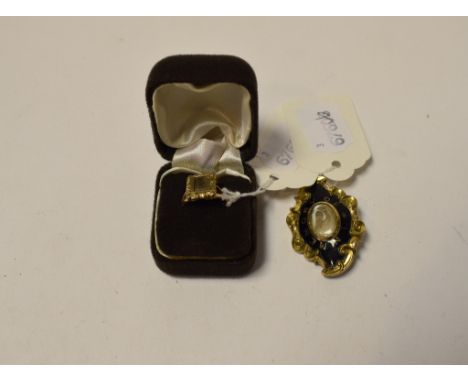 A memoriam brooch, the central hair locket surrounded by black enamel, and a 9ct gold memoriam ring, with hair window, approx