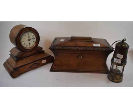 An early Victorian rosewood tea caddy, gutted, 37 cm wide, a mantel clock, a pewter charger, an Art Nouveau style pewter tray