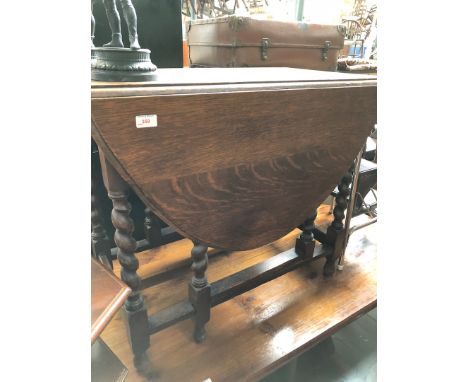 A twist oak gate leg table 