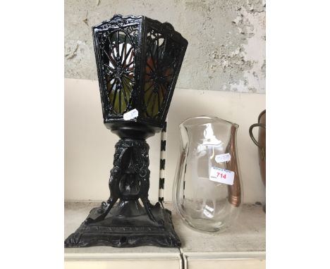 A Holmgaard glass vase etched with a deer and a cast metal lamp. 