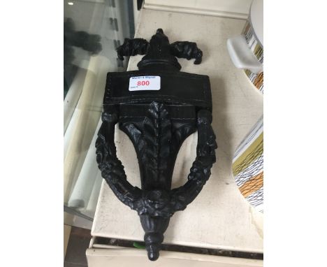 A cast metal door knocker 