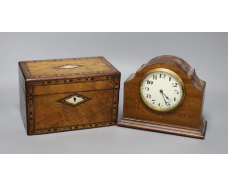 A Victorian walnut and marquetry tea caddy and an inlaid mahogany mantel timepiece,box 20 cms wide 13 cms high,