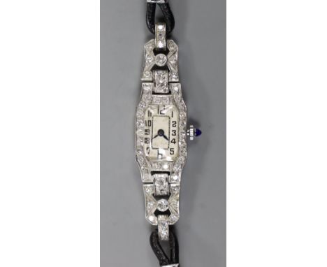 A lady's 1940's white metal (stamped plat) and diamond set manual wind cocktail watch, with Arabic dial, on fabric strap, gro