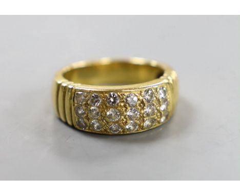 A yellow metal and eighteen stone pave set diamond ring, size Q/R, gross weight 10.7 grams.