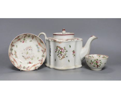 A New Hall type teapot and a similar tea bowl and saucer,teapot 15 cms high,