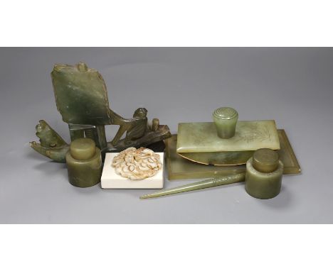 A Chinese bowenite jade desk set (7) and a plaque,model of junk 16cms high,