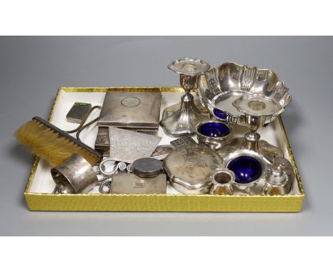 Assorted silver including a pierced bowl, pair of dwarf candlesticks, four condiments(a.f.), cigarette box, lid, 19th century