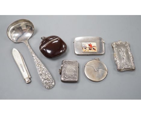 Four assorted early 20th century silver vesta cases, including a silver gilt mounted nut, and patent action circular, togethe