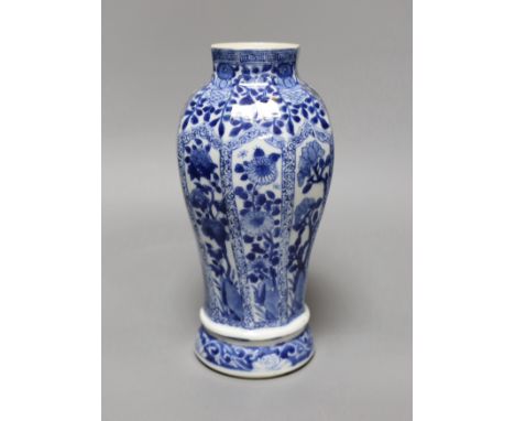 A Chinese blue and white vase, Kangxi period,23 cms high,