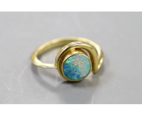 A modern 18ct gold and white opal set ring, size R, gross weight 6.2 grams.