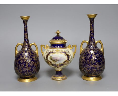A  pair of Royal Worcester bottle vases and a Coalport landscape vignette vase and cover, pair of vases 20 cms high,