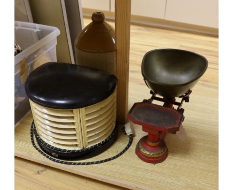 A 1930's HMV bakelite electric heater, A Mattocks cast iron weighing scale and a Lewes stoneware jar