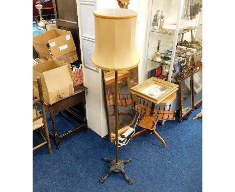A brass standard lamp with ornate cast iron 19thC. William Tonks &amp; Son base 62in high