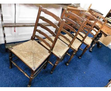 A set of four antique ladder back rush seat chairs