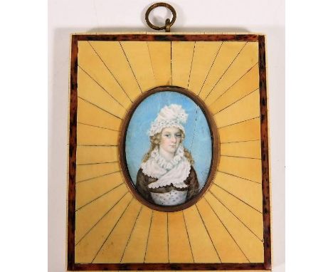 A c.1800 ivory mounted portrait watercolour set within a yellow metal memorial locket with hair &amp; gold initials to verso,