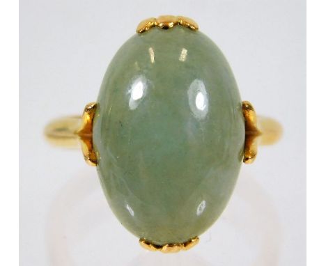 An antique Chinese yellow gold ring, tests at 20ct, set with jade stone 6.1g size K/L 