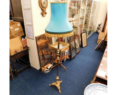 An antique style brass standard lamp with turquoise shade 66in 