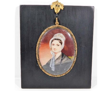 An early 19thC. Scottish school portrait miniature watercolour of young woman in bonnet, frame size 6in x 5.25in