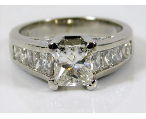 A fine platinum diamond ring set with centre stone of 1.07ct, approx. 2.2ct in total 8.9g size K 