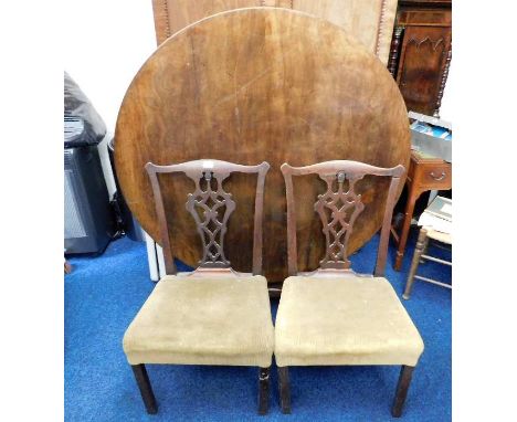 A pair of 19thC. Chippendale style mahogany dining chairs twinned with a Victorian mahogany veneered breakfast table with 50i