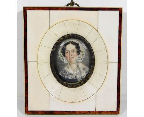 A 19thC. ivory framed portrait watercolour of lady in bonnet, frame size 4.25in x 3.75in