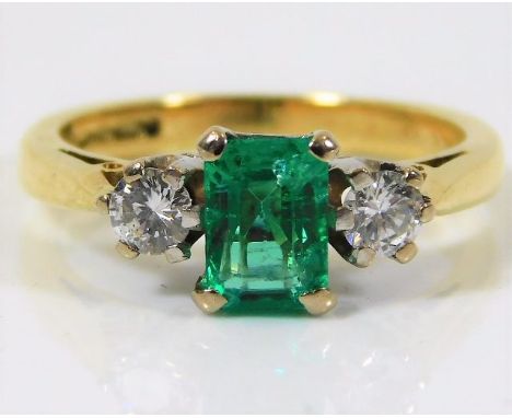 An 18ct gold ring set with emerald &amp; approx. 0.3ct diamond 3.7g size J/K