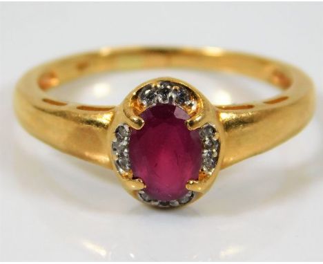 An 18ct gold ruby &amp; diamond ring 3.8g size R 