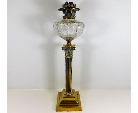A Victorian brass corinthian column oil lamp 25in high. Provenance: From Trematon Hall, Saltash