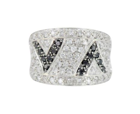 Thick white gold band with small brilliant cut clear diamonds and two black diamond arrow shapes. 7.62g. Size 7.5. Condition: