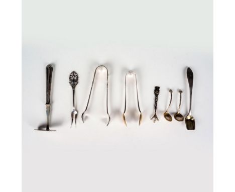 Includes 1 sugar tongs,1 ice tongs, 1 salt poon, 2 small salt cellar spoons, 1 relish fork, 1 tiny souvenir fork, and 1 baby 