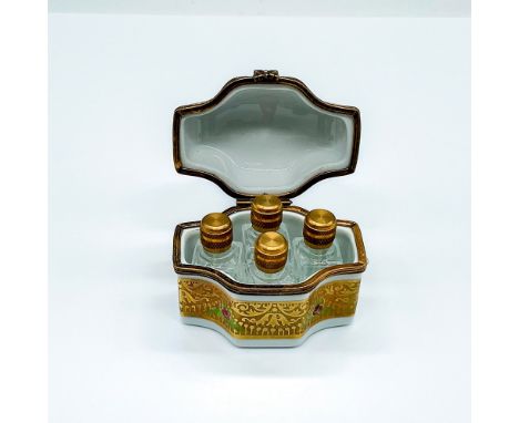 A stunning small hand painted hinged box adorned in gild inlay and rose enamel. Inside contains 4 miniature glass perfume bot