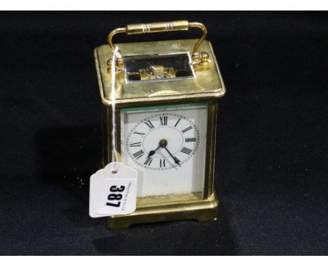 A Brass Encased Carriage Clock With Key