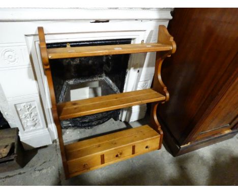 A Stripped Pine Wall Rack With Three Spice Drawers