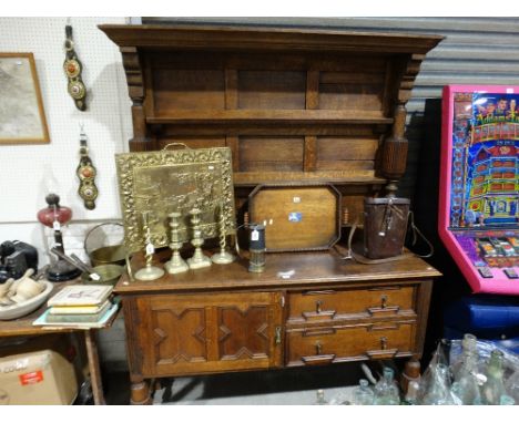 An Early 20th Century Oak Dresser Having A 2 Shelf Rack and Open Base