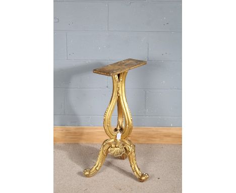 19th century carved and gilt table pedestal, with triple beaded scrolled supports raised on three leaf and beaded scroll feet